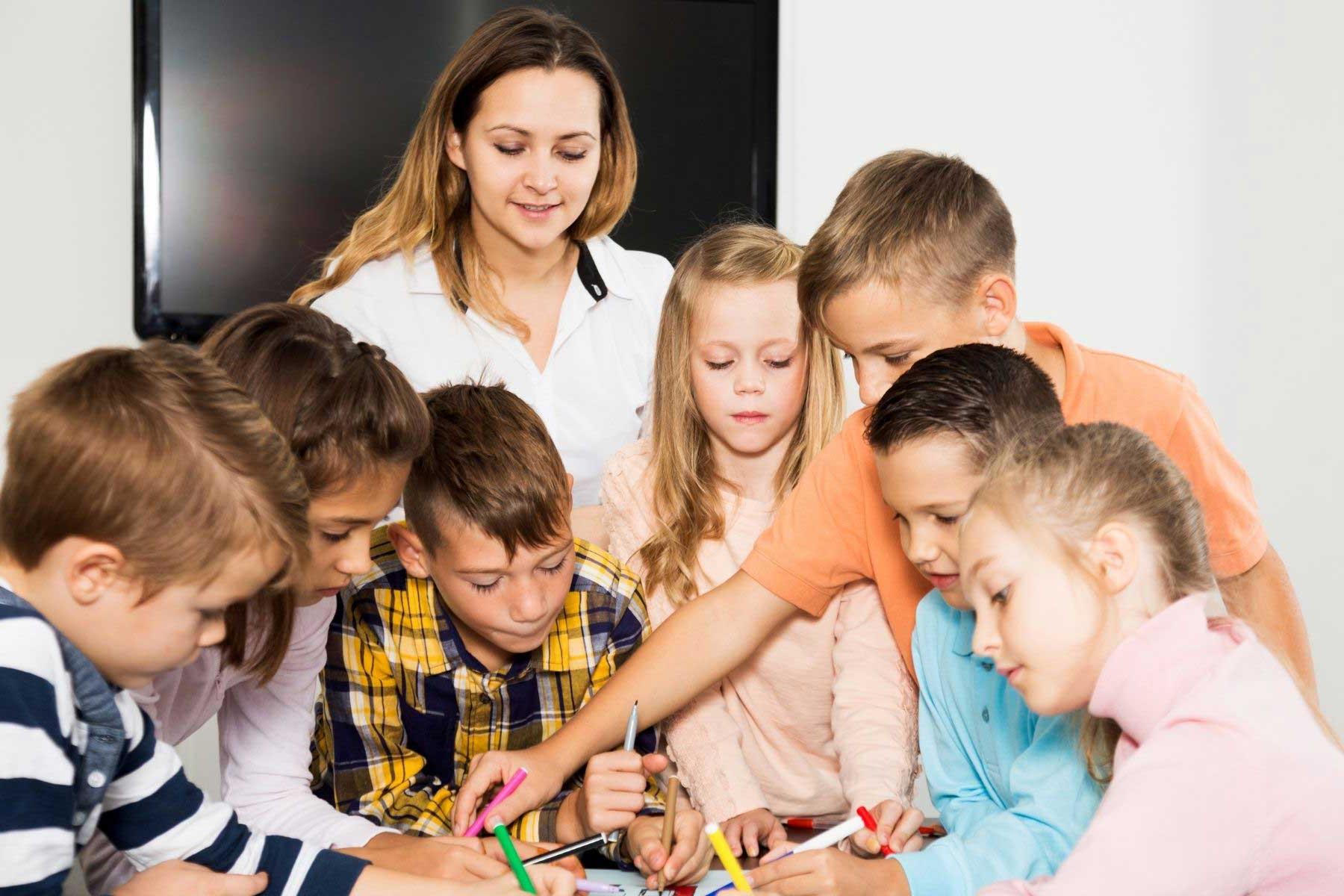 Preschool teacher with children