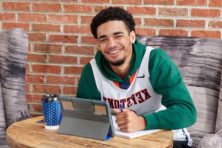 Student studying on a laptop